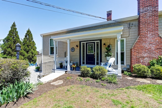 5 Quarry Rd, Stonington, CT 06355 - view of front of house featuring a porch and a chimney