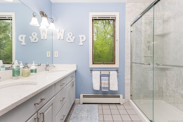full bath featuring a baseboard radiator, tile patterned flooring, a stall shower, double vanity, and baseboards