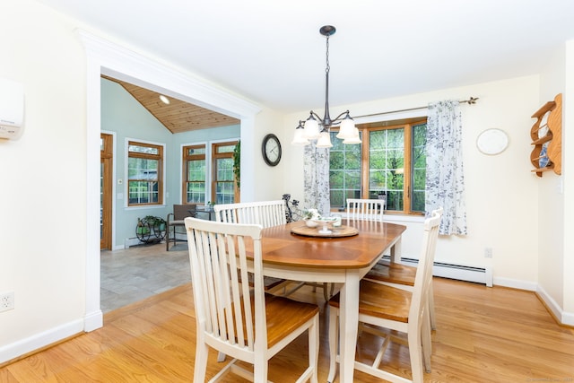 dining room featuring a baseboard radiator, a chandelier, baseboards, light wood-style flooring, and lofted ceiling