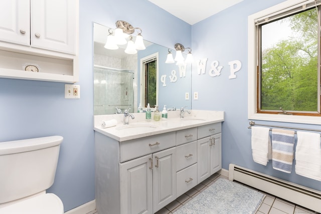 bathroom featuring a baseboard radiator, toilet, a shower stall, tile patterned flooring, and double vanity