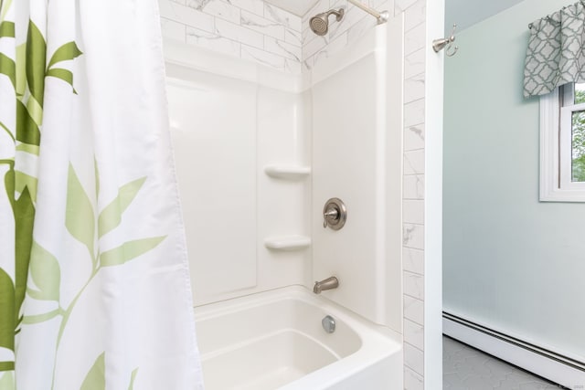 bathroom with baseboard heating and shower / tub combo with curtain