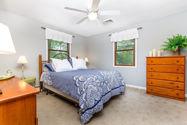 bedroom with carpet, baseboards, and ceiling fan