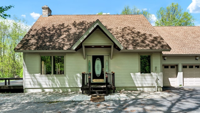 233 N Society Rd, Canterbury, CT 06331 - view of front of home featuring a chimney, a shingled roof, and a garage