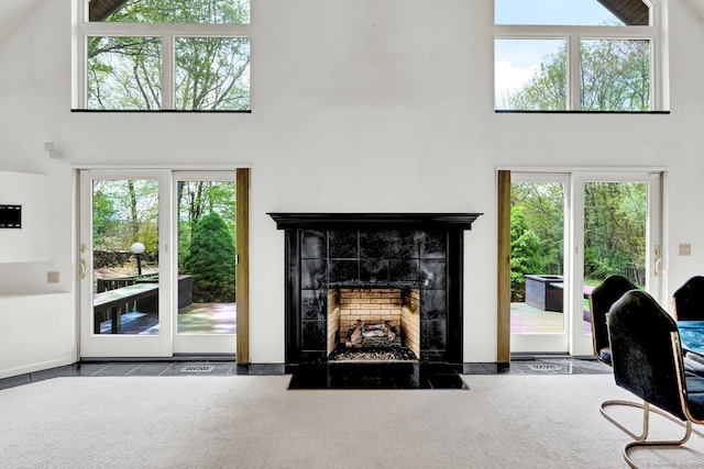 233 N Society Rd, Canterbury, CT 06331 - living area with a high ceiling, a fireplace, and plenty of natural light