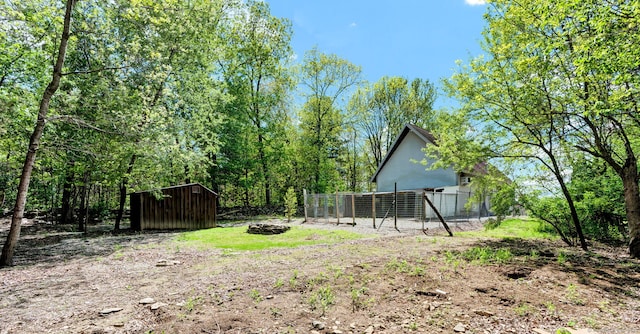 233 N Society Rd, Canterbury, CT 06331 - view of yard featuring an outbuilding, fence, and a storage unit