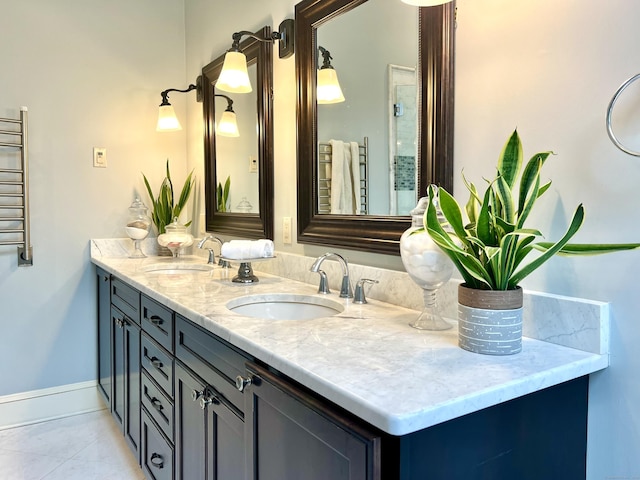 10 Woods End Dr, Wilton, CT 06897 - full bathroom featuring double vanity, radiator, a towel warming rack, and tile patterned flooring