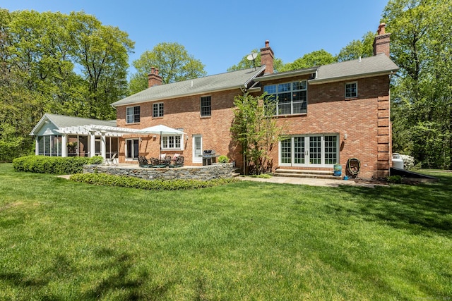 16 Cider Mill Rd, Burlington, CT 06013 - back of house featuring a pergola, a chimney, brick siding, a yard, and french doors