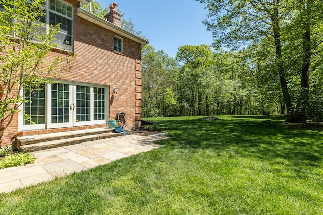 16 Cider Mill Rd, Burlington, CT 06013 - view of green lawn featuring french doors and entry steps