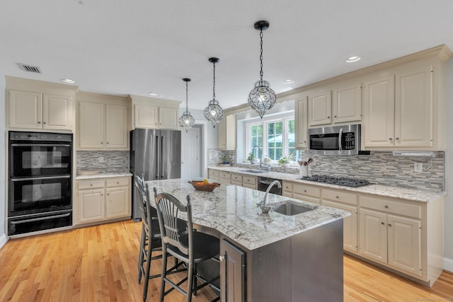 16 Cider Mill Rd, Burlington, CT 06013 - kitchen with stainless steel appliances, a warming drawer, a center island with sink, backsplash, and recessed lighting
