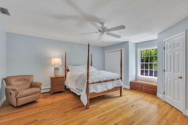 16 Cider Mill Rd, Burlington, CT 06013 - bedroom with a baseboard radiator, light wood-type flooring, and ceiling fan