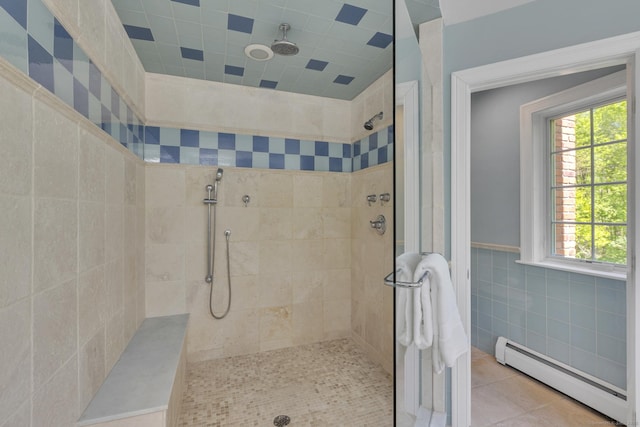 16 Cider Mill Rd, Burlington, CT 06013 - full bath with a baseboard radiator, tiled shower, tile patterned floors, tile walls, and wainscoting