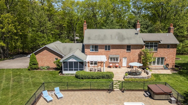 16 Cider Mill Rd, Burlington, CT 06013 - rear view of property with a patio area, a sunroom, a chimney, and brick siding