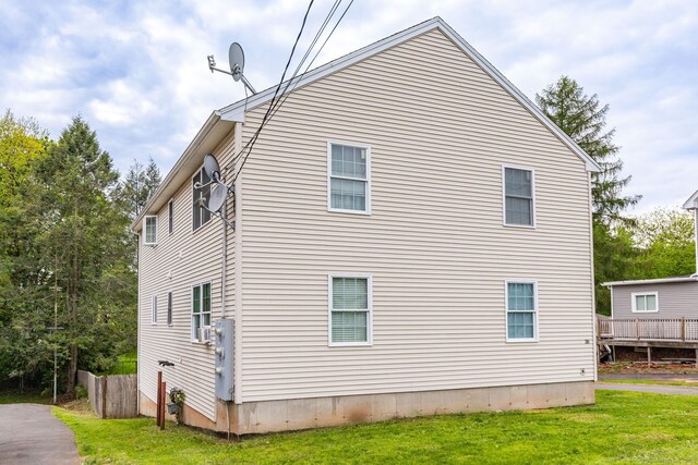 view of home's exterior featuring a yard
