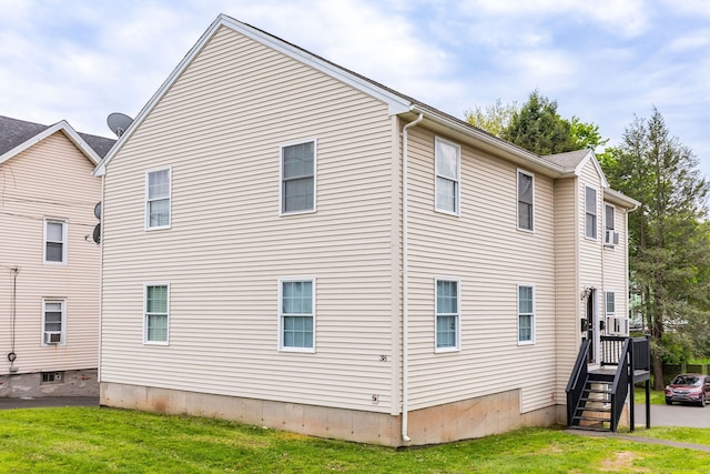 view of home's exterior featuring a yard and a deck