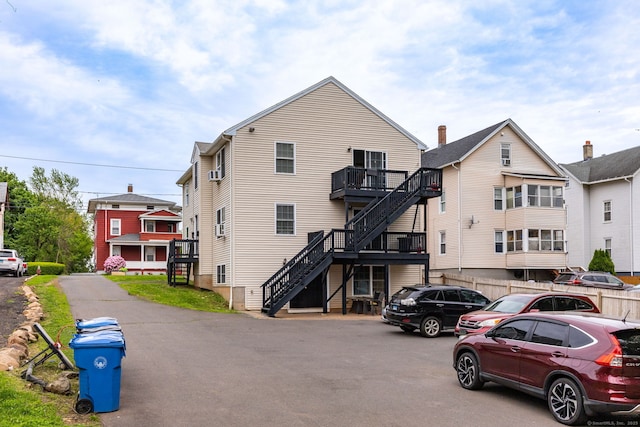 back of property with stairs