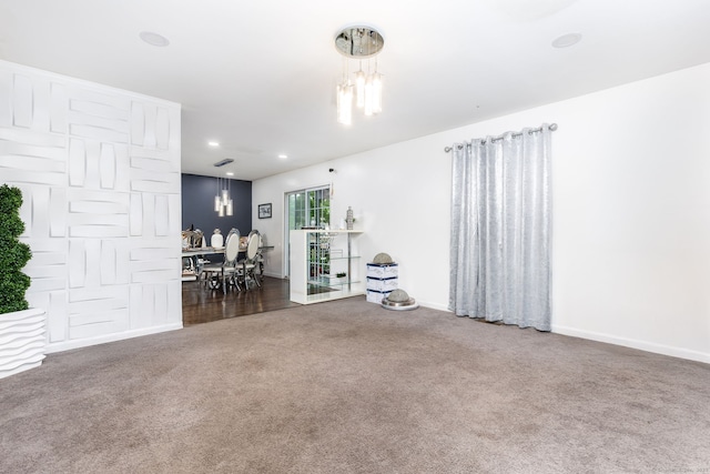 living room with carpet, a chandelier, baseboards, and recessed lighting