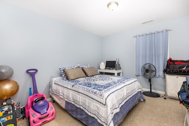 bedroom with carpet and baseboards