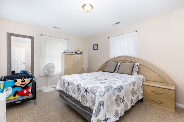 bedroom with carpet flooring and baseboards