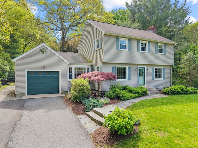 5 Willow Ln, East Lyme, CT 06333 - colonial-style house with a garage, driveway, a chimney, and a front yard