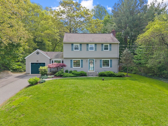 5 Willow Ln, East Lyme, CT 06333 - colonial house with a chimney, driveway, a garage, and a front yard