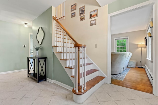 5 Willow Ln, East Lyme, CT 06333 - staircase featuring tile patterned flooring, a baseboard heating unit, and baseboards