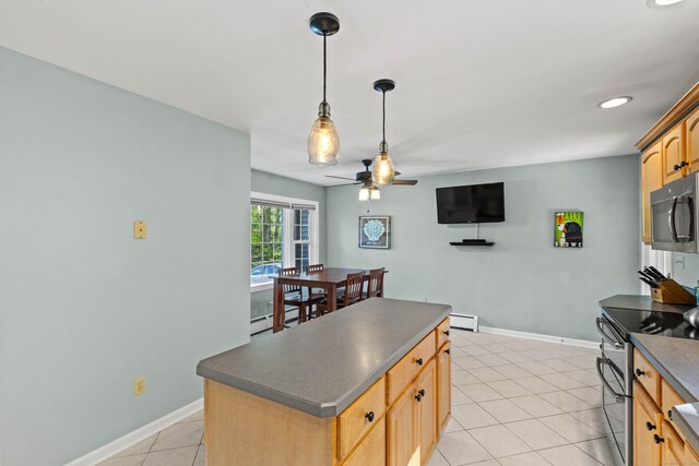 5 Willow Ln, East Lyme, CT 06333 - kitchen with black microwave, range with two ovens, dark countertops, ceiling fan, and recessed lighting