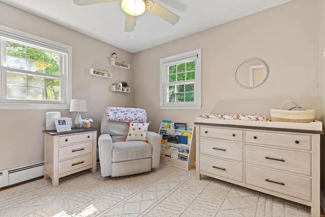 5 Willow Ln, East Lyme, CT 06333 - living area featuring a ceiling fan and a baseboard radiator