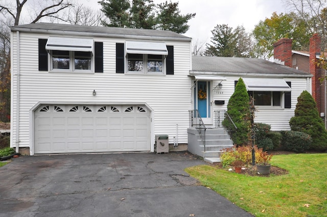1268 Trout Brook Dr, West Hartford, CT 06119 - split level home featuring asphalt driveway, a garage, and roof with shingles