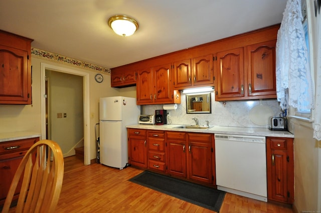 1268 Trout Brook Dr, West Hartford, CT 06119 - kitchen featuring white appliances, light countertops, backsplash, and light wood-style floors