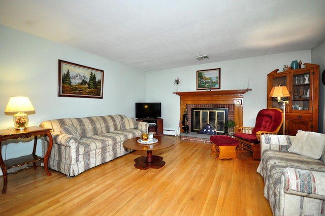 1268 Trout Brook Dr, West Hartford, CT 06119 - living area featuring a baseboard radiator, wood finished floors, and a fireplace