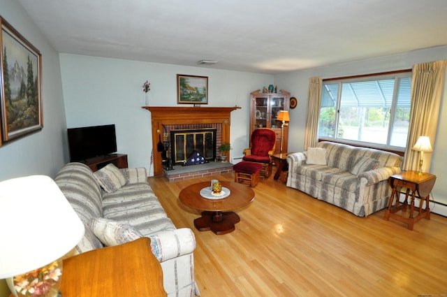 1268 Trout Brook Dr, West Hartford, CT 06119 - living area featuring wood finished floors, a fireplace, and a baseboard radiator