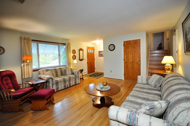 1268 Trout Brook Dr, West Hartford, CT 06119 - living area with wood finished floors, baseboard heating, and stairway
