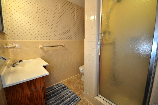 1268 Trout Brook Dr, West Hartford, CT 06119 - full bath with a stall shower, vanity, toilet, tile walls, and wainscoting