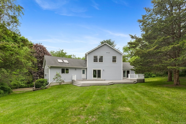 98 Hemlock Valley Rd, East Haddam, CT 06423 - rear view of property featuring a lawn, a wooden deck, and roof with shingles