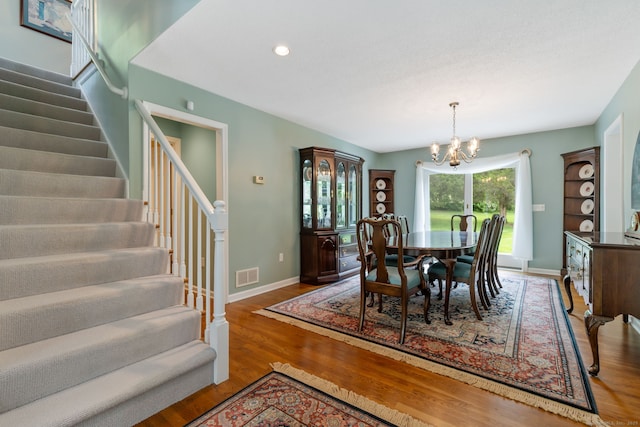 98 Hemlock Valley Rd, East Haddam, CT 06423 - dining area with a chandelier, stairs, wood finished floors, baseboards, and recessed lighting
