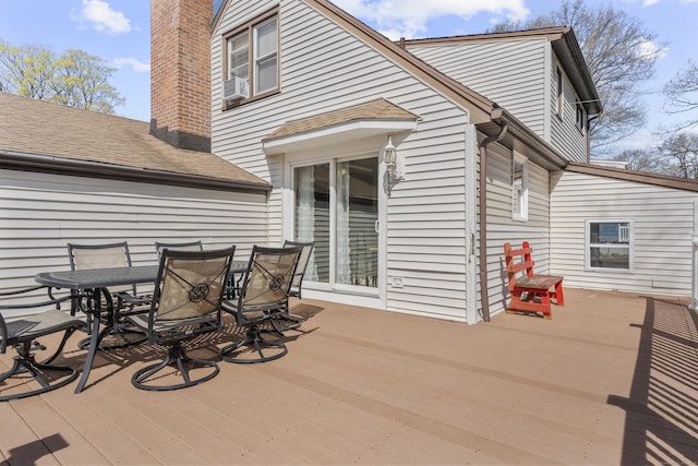 deck featuring outdoor dining area and cooling unit