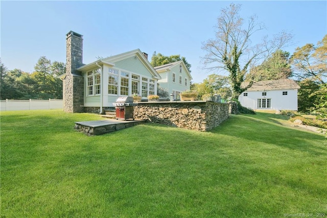 521 State St, Guilford, CT 06437 - back of house with a chimney and a sunroom