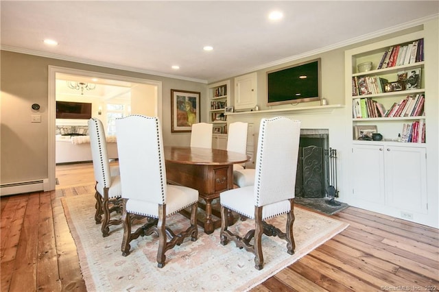 521 State St, Guilford, CT 06437 - dining area with crown molding, light wood-type flooring, a baseboard heating unit, built in features, and recessed lighting