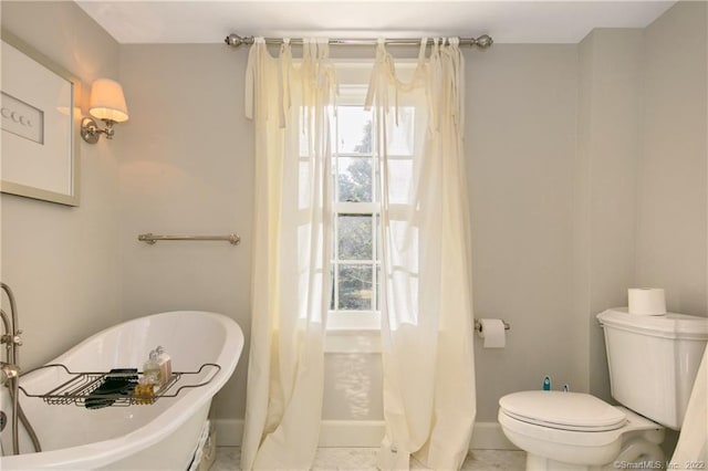 521 State St, Guilford, CT 06437 - full bathroom with toilet, baseboards, and a freestanding bath
