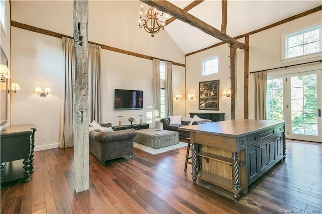 521 State St, Guilford, CT 06437 - living room featuring high vaulted ceiling, dark wood-type flooring, a chandelier, and baseboards
