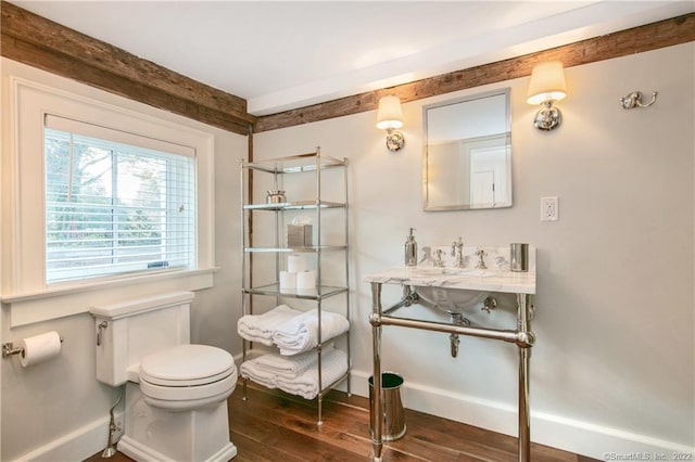 521 State St, Guilford, CT 06437 - bathroom with toilet, wood finished floors, baseboards, and beamed ceiling