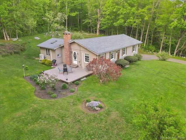 20 Thayer Road Ext, Haddam, CT 06441 - back of property with a deck, a yard, a chimney, and a wooded view