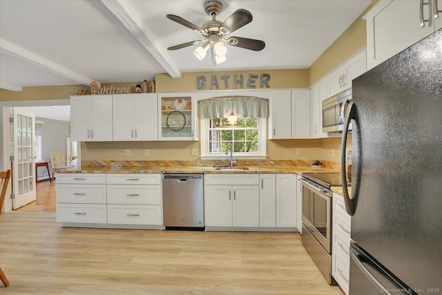 20 Thayer Road Ext, Haddam, CT 06441 - kitchen featuring appliances with stainless steel finishes, a sink, white cabinetry, beamed ceiling, and ceiling fan