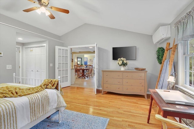 20 Thayer Road Ext, Haddam, CT 06441 - bedroom featuring a wall mounted AC, lofted ceiling, light wood-style flooring, a closet, and a ceiling fan