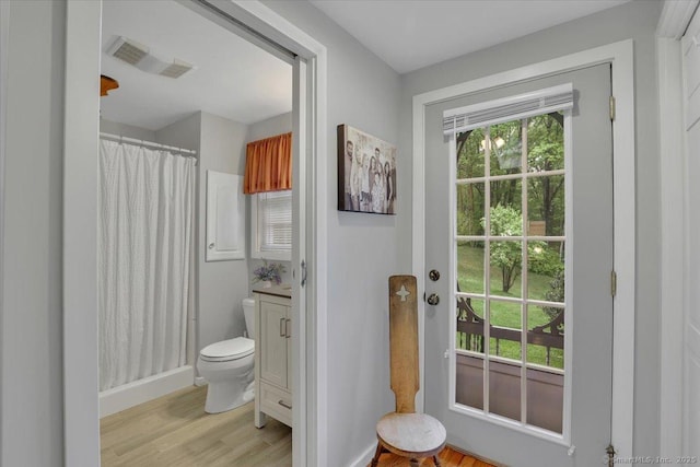 20 Thayer Road Ext, Haddam, CT 06441 - full bath with wood finished floors, toilet, vanity, a shower with curtain, and baseboards