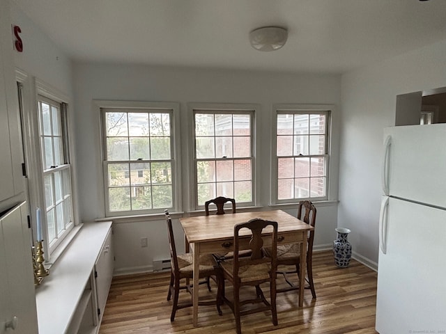 24 Saint Johns Pl Apt 6, New Canaan, CT 06840 - dining room with wood finished floors and baseboards
