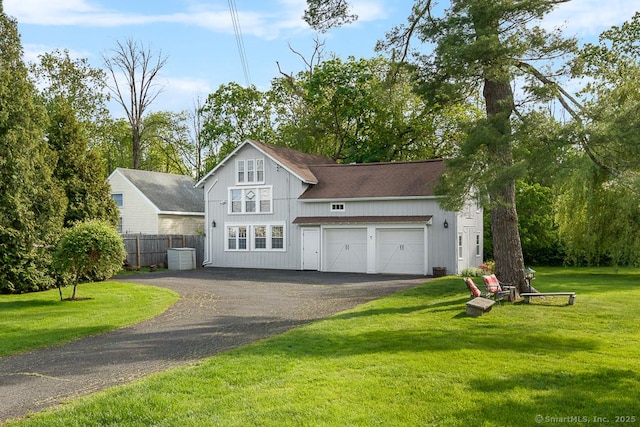 1050 King St, Greenwich, CT 06831 - view of front facade with driveway and a garage