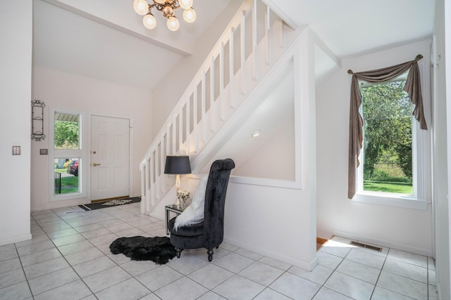 592 Mountain Rd Unit A, West Hartford, CT 06117 - entryway with healthy amount of natural light, stairway, light tile patterned floors, a chandelier, and lofted ceiling