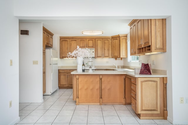 592 Mountain Rd Unit A, West Hartford, CT 06117 - kitchen featuring freestanding refrigerator, light countertops, light tile patterned flooring, and a peninsula