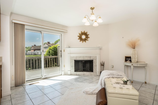 592 Mountain Rd Unit A, West Hartford, CT 06117 - tiled living area featuring a chandelier and a tiled fireplace